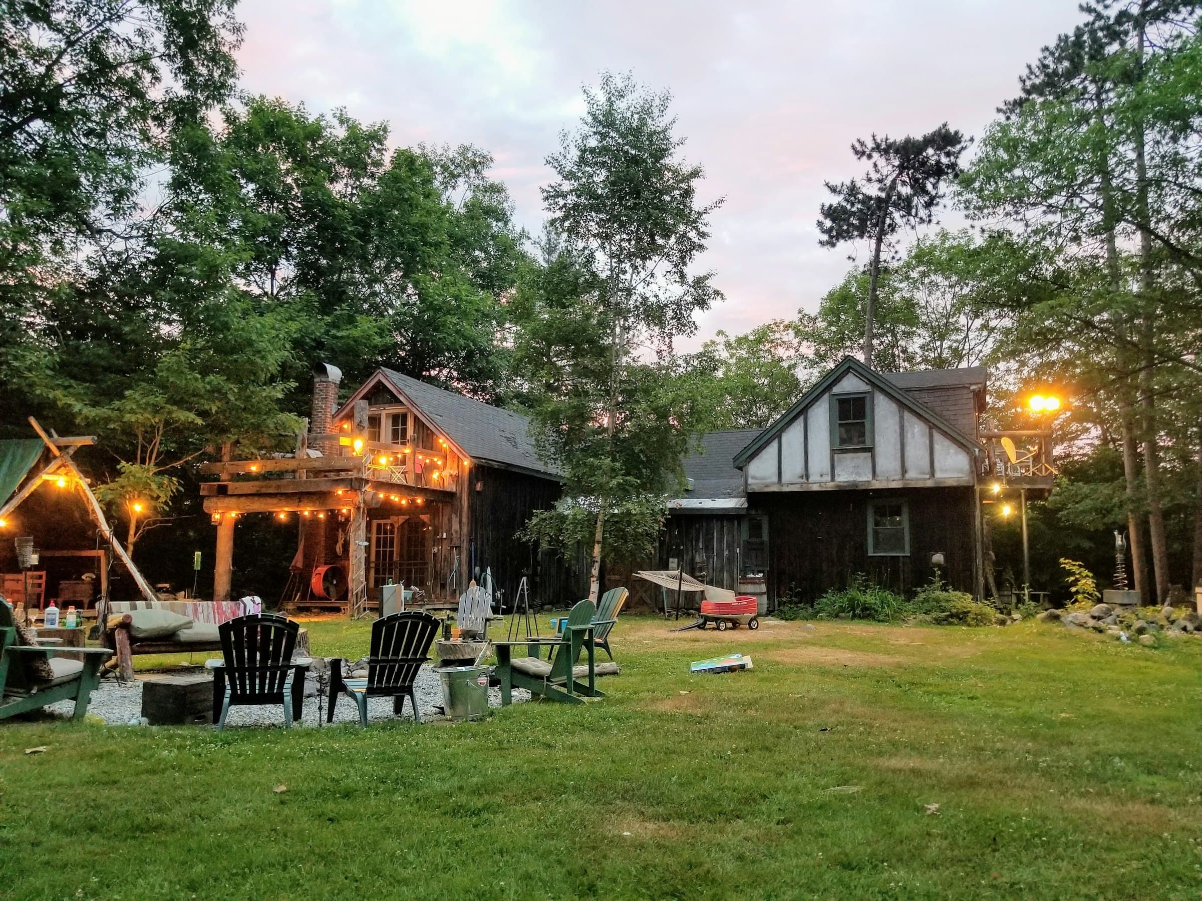 Landscape lighting illuminating the exterior of a house at night